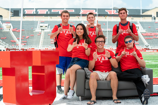 group of students wearing utes shirts on a football field
