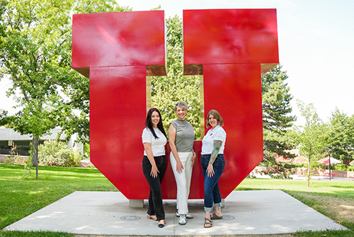 Training group posing in front of Block U on campus